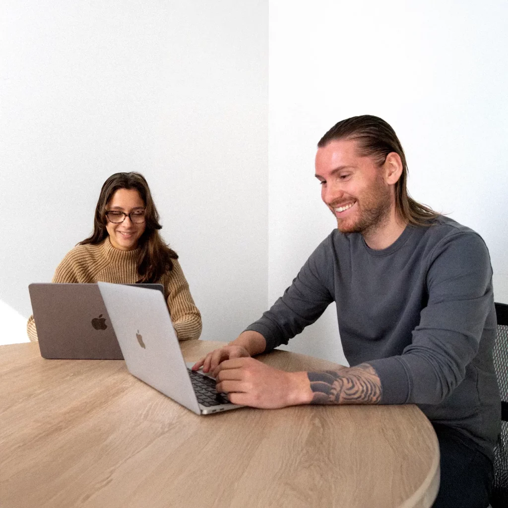 two account managers from PWD working on a digital marketing client